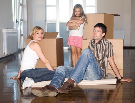 Unpacking services arranging furniture in new home